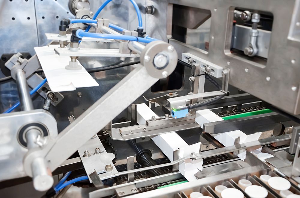 5.-Cartonnage-Push-Capsules-dans-des-bo&icirc;tes