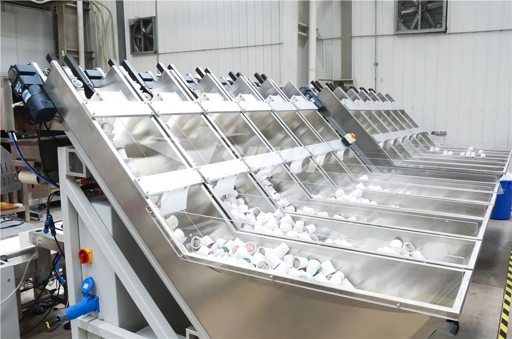 1.-Syst&egrave;me d'alimentation automatique pour dosettes de caf&eacute; Kcup